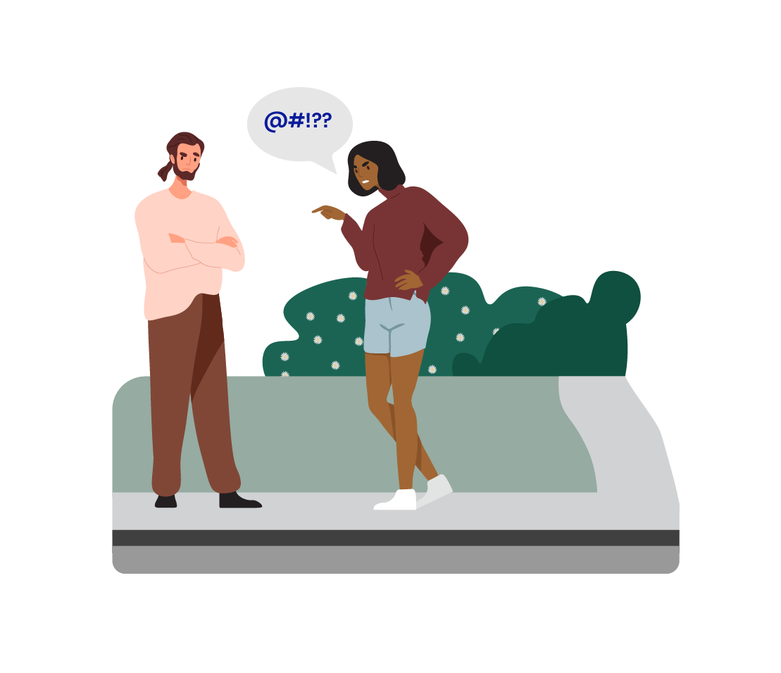 Two people are having a heated conversation outside, near some bushes.
