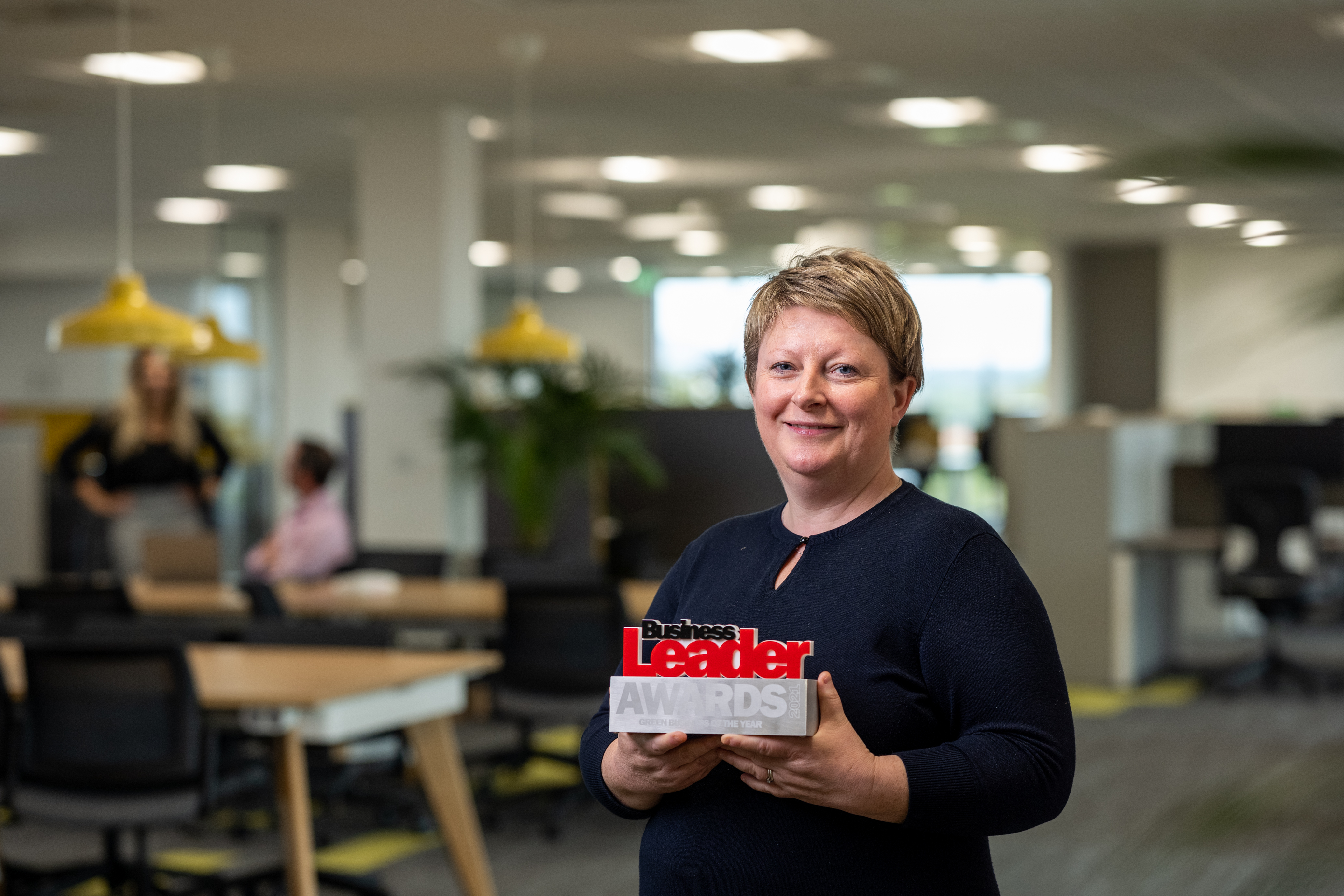 Glynnis holding our Green Business Award