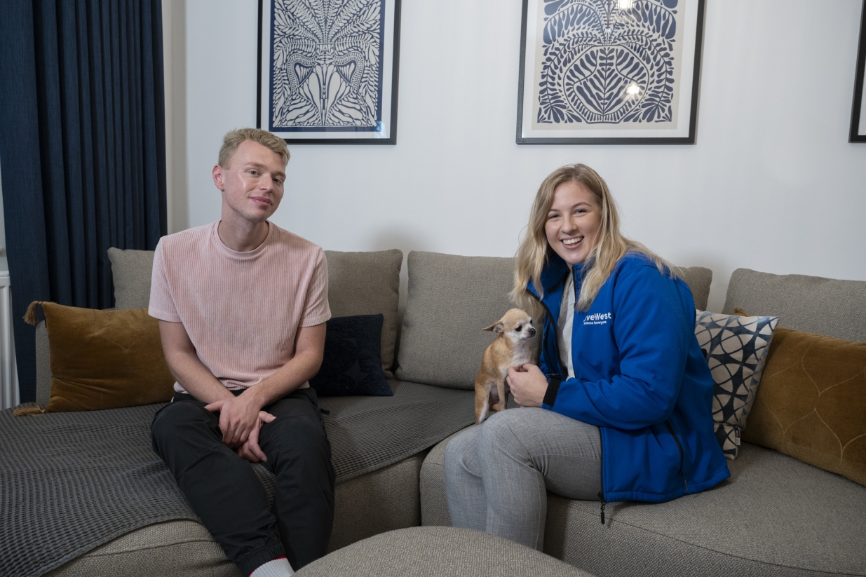 Jack (left) smiling with one of our LiveWest colleague and his dog.