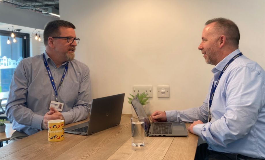 Paul Parsons (left) talking to one of his colleagues.