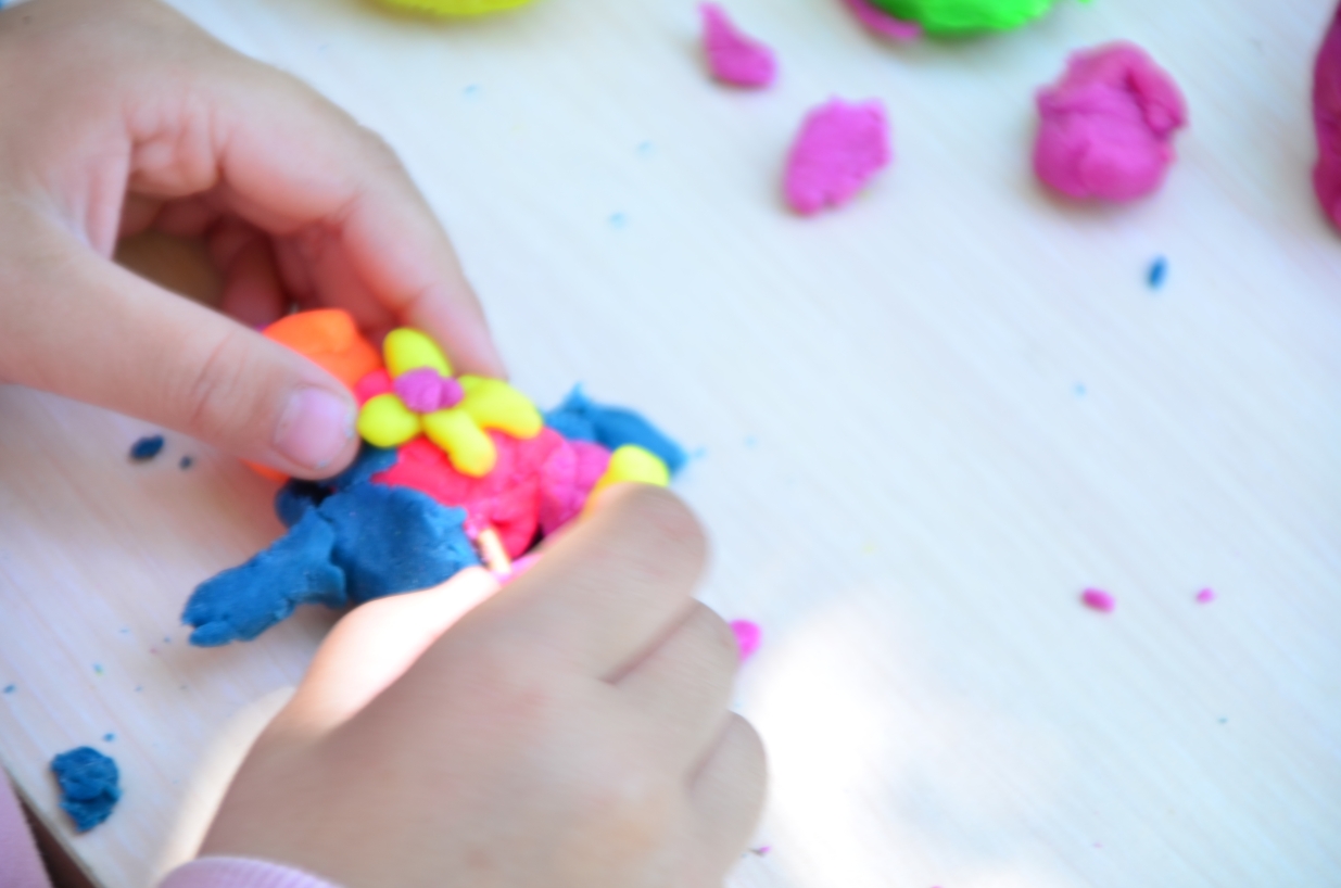 Child playing with play dough