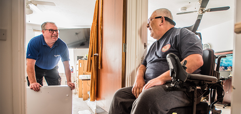 Customer in a wheelchair talking to a LiveWest colleague