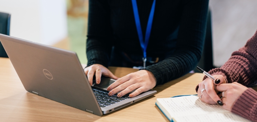 A LiveWest colleague using a laptop. 