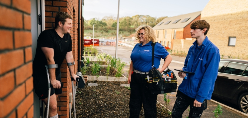 LiveWest colleagues speaking to a customer outside their home. 