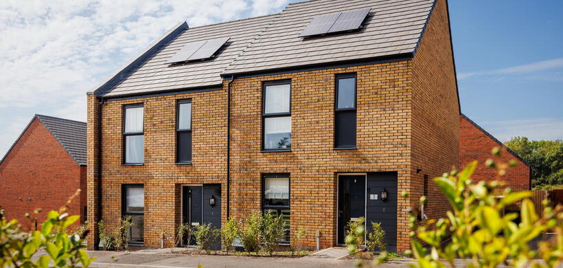 LiveWest homes with greenery and solar panels