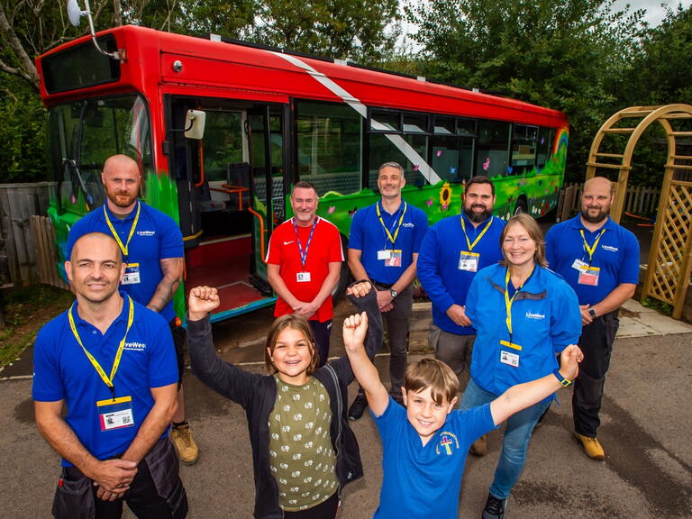 Volunteers with the upcycled bus