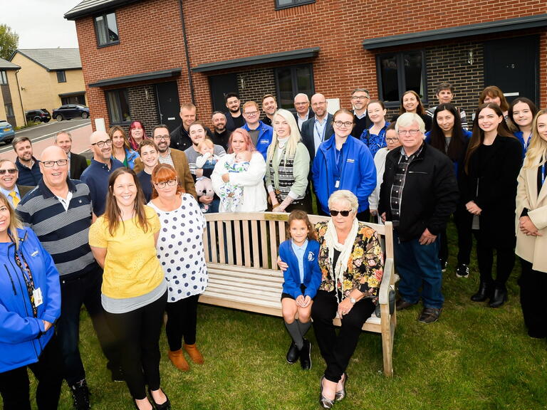 Councillor Paul Whaites’ family and LiveWest staff on the bench dedicated to councillor Whaites