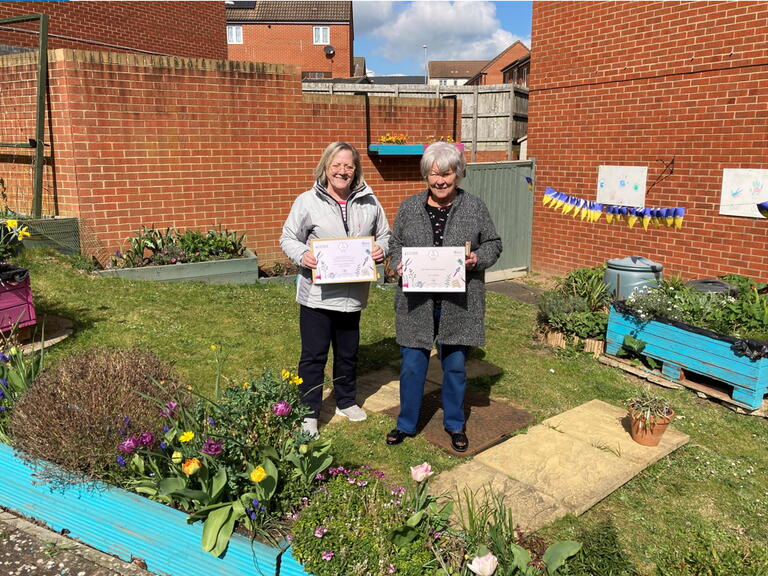 Vyv and Kate at the community garden