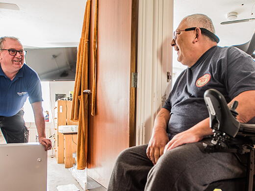 Customer in a wheelchair talking to a LiveWest colleague