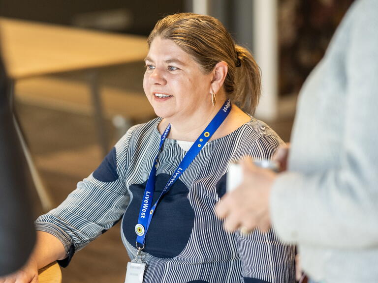 LiveWest colleague in a blue sunflower lanyard