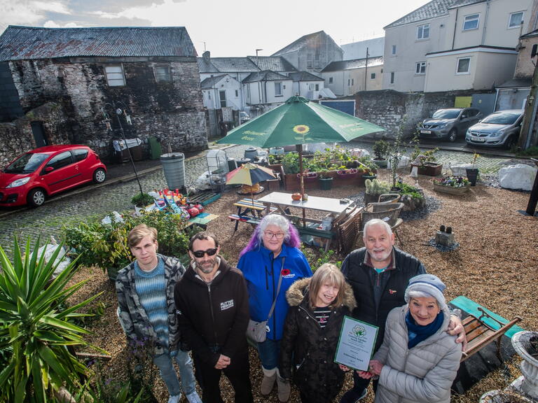 The group of volunteers at the community garden.