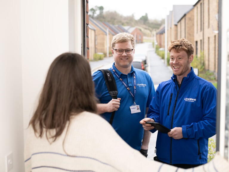 Trades colleagues at a customer's door