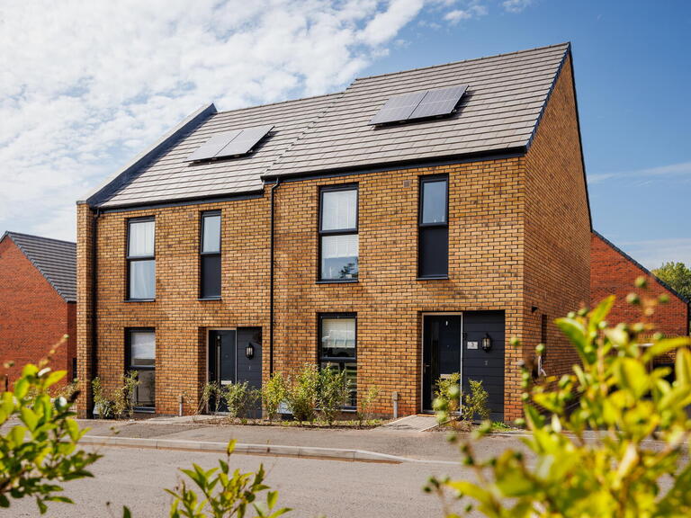 LiveWest homes with greenery and solar panels