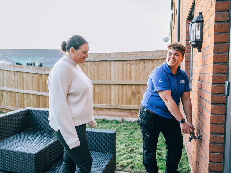 Georgia doing an outside repair with a resident