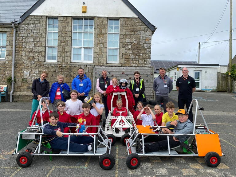 Pupils, teachers and contractors with the Greenpower Goblin car built by the pupils.