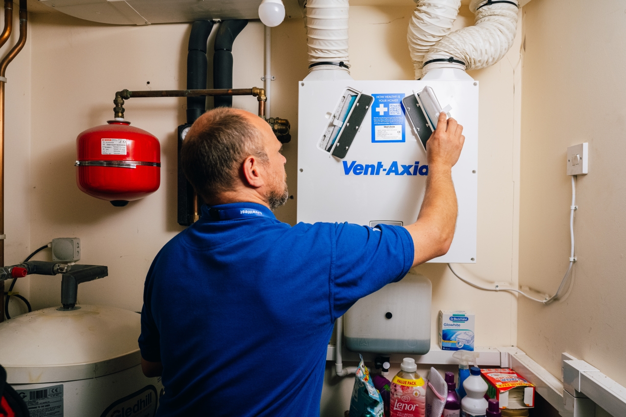 LiveWest colleague working on a boiler.
