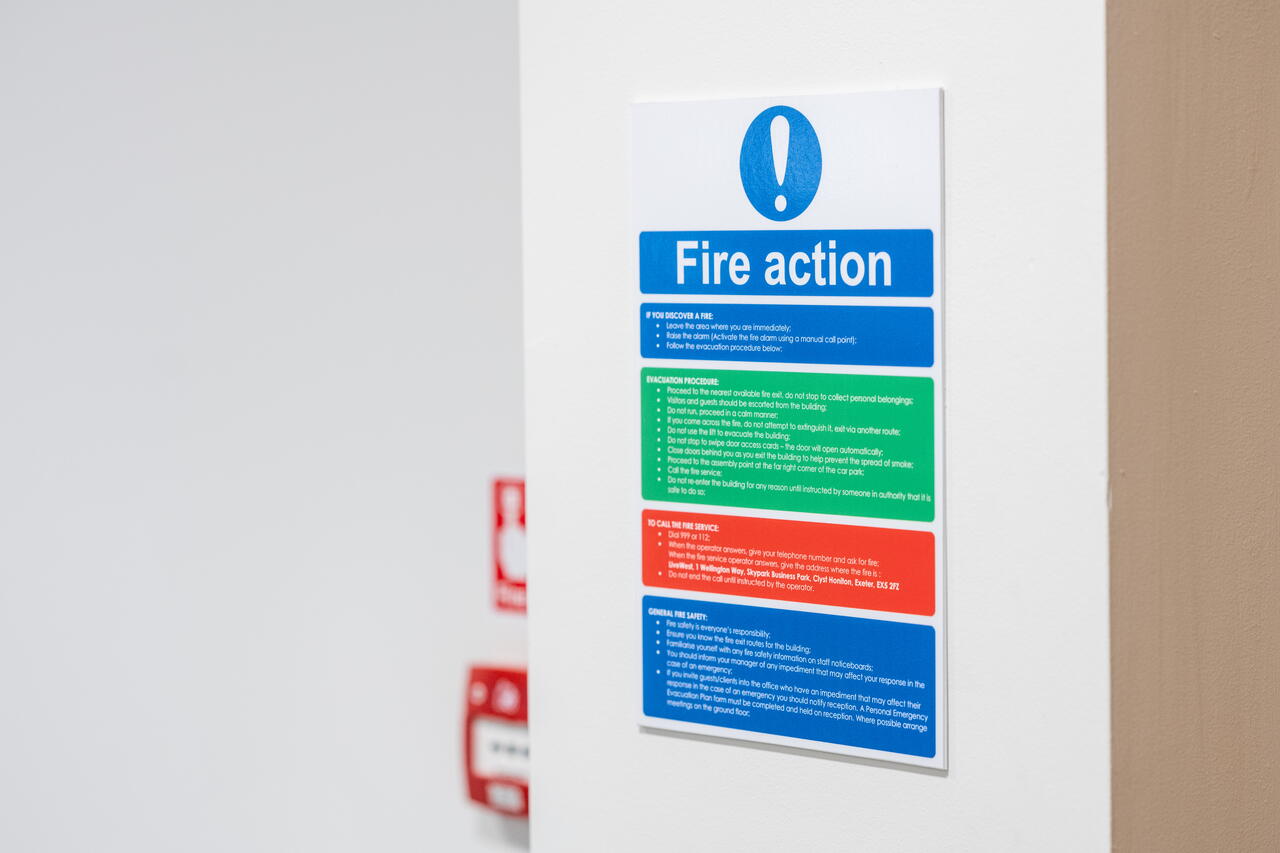 Fire action poster on a wall