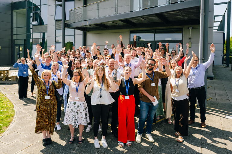 LiveWest colleagues cheering at a Qualification Event