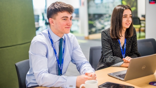 Two apprentices smiling 