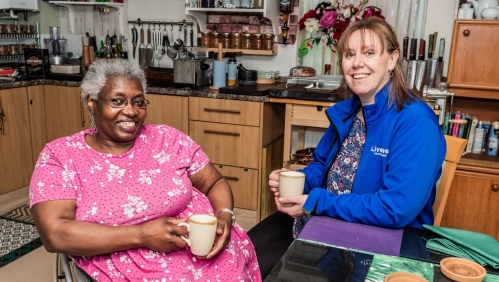 Our InFocus member, Sue smiling alongside one of our colleagues.