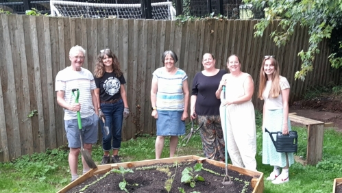 A group of volunteers in the new community garden.