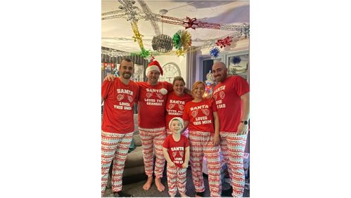 Jayne and her family in matching Christmas pyjamas. 