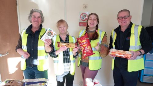 The volunteers with some of the food available at the larder. Image: LiveWest