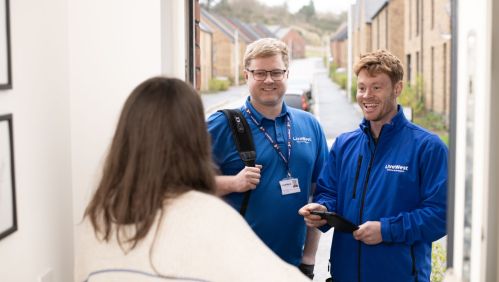 Trades colleagues at a customer's door