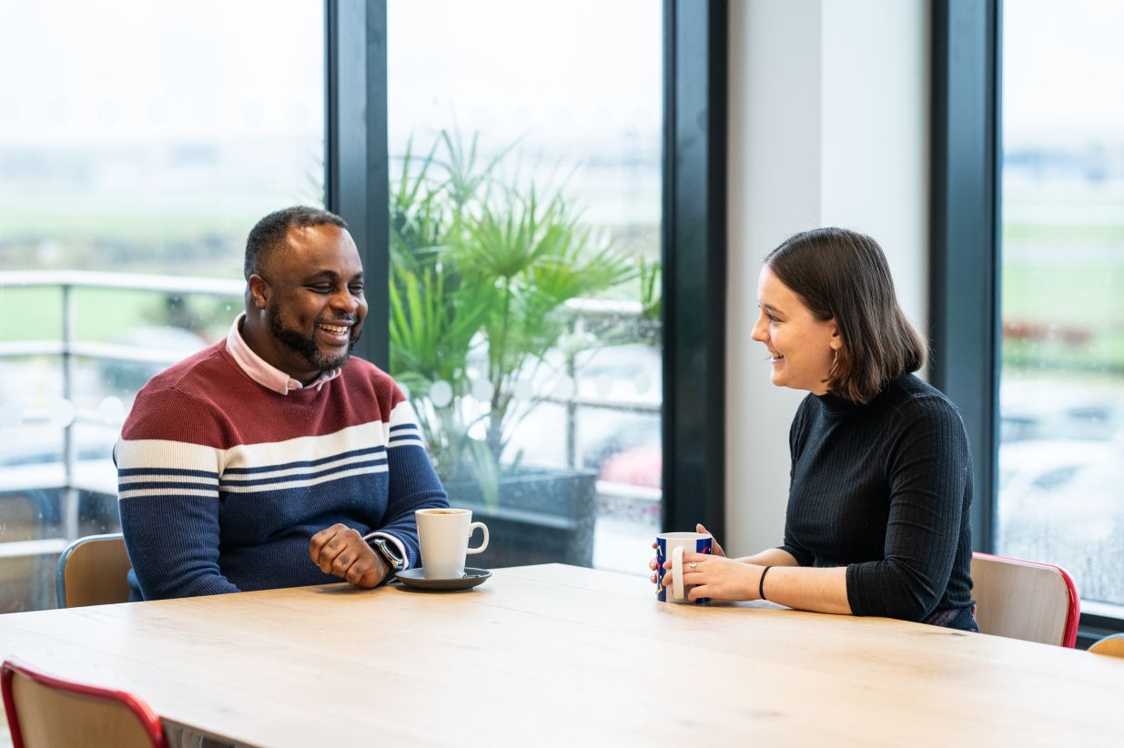 Colleagues sat at a table